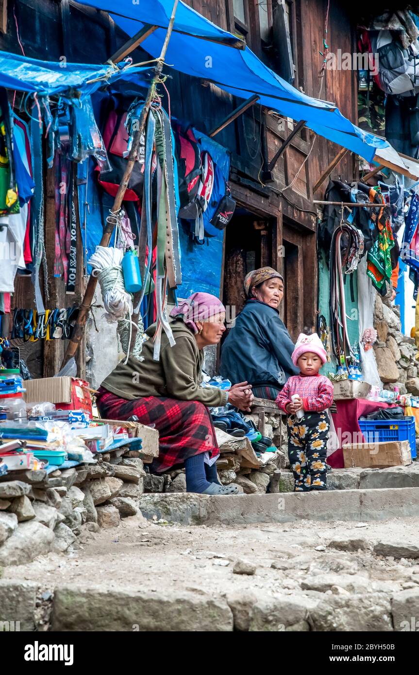 Nepal. Island Peak Trek. Colourful street scenes on the main street with shops and stores in and around the Solu Khumbu main trading and Sherpa town of Namche Bazaar Stock Photo