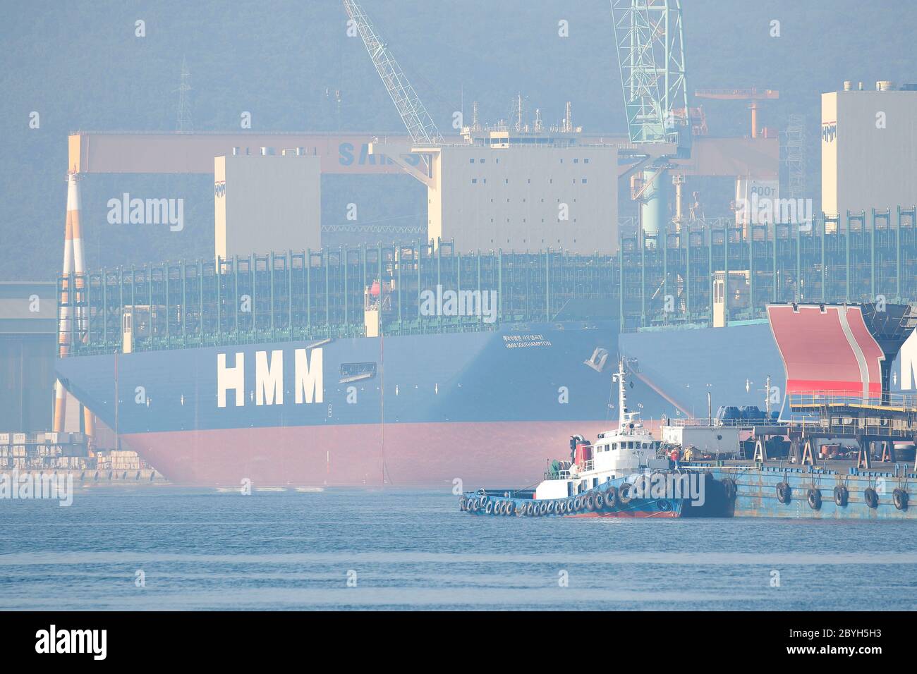 June 10, 2020, Geoje, GYEONGNAM, SOUTH KOREA: June 10, 2020-Geoje, South Korea- A View Scene of Container Carrier building yard at SHI (Samsung Heavy Industry) in Geoje, South Korea. Korea Shipbuilding & Offshore Engineering Co., the shipbuilding holding company of South Korea's Hyundai Heavy Industries Group, said Tuesday it has won a 90 billion-won (US$75 million) order to build two petrochemical carriers. The two 50,000-ton vessels will be built by Hyundai Mipo Dockyard Co., a subsidiary of Korea Shipbuilding, starting October this year, and they will be delivered to a European company by t Stock Photo