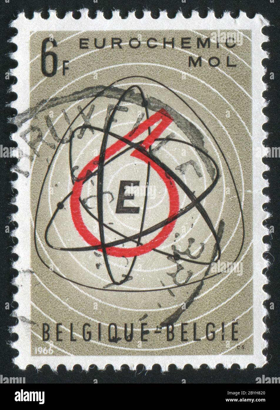 BELGIUM - CIRCA 1966: Atom Symbol and Retort, circa 1966. Stock Photo