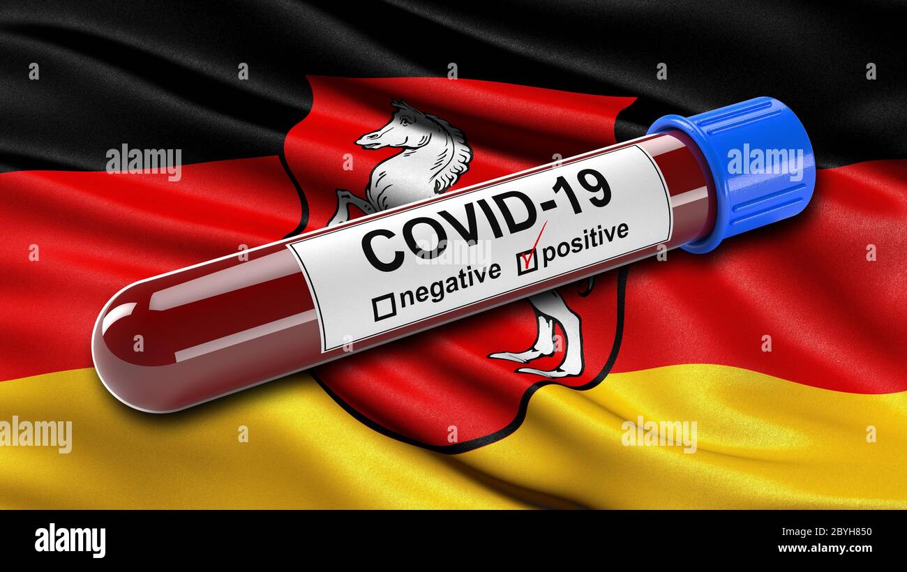 Flag of Lower Saxony waving in the wind with a positive Covid-19 blood test tube. Stock Photo