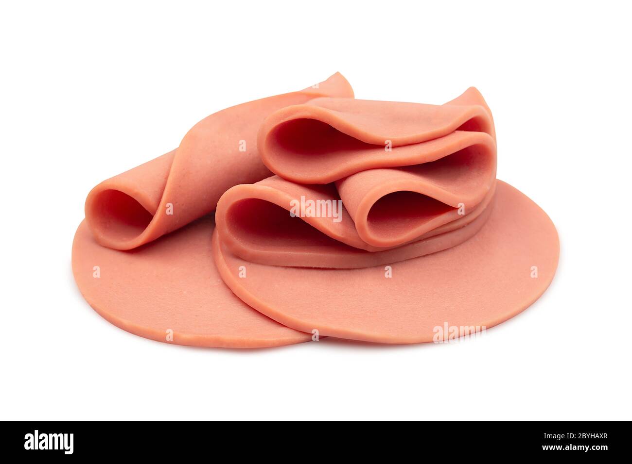 Sliced of bologna sausage rolled and heap on white isolated background