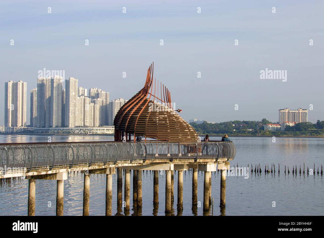 The observation point next to kingfisher pond in the Sungei Buloh wetland reserve Singapore. The background is the buildings of JOHOR BAHRU Malaysia. Stock Photo