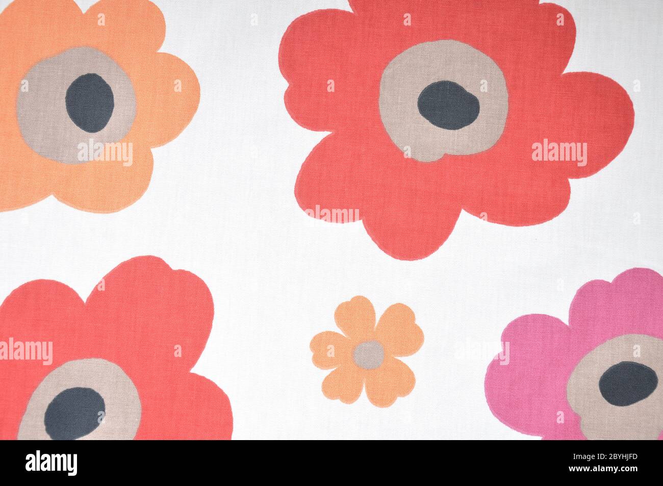 Fragment of colorful retro textile pattern with floral ornament useful as background. Stock Photo