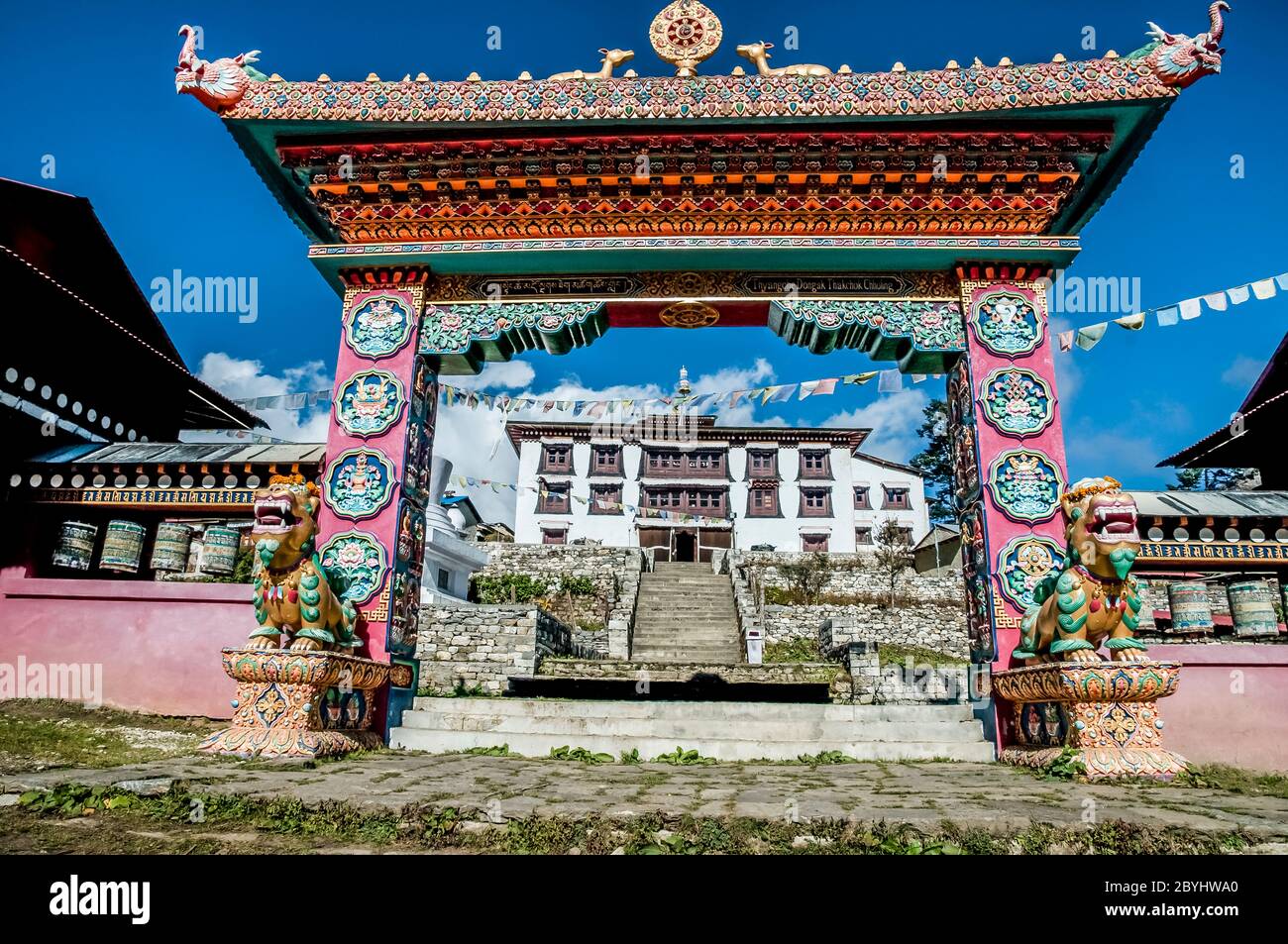 Nepal. Trek to Island Peak. Colourful scenes in and around the Thyangboche Buddhist Monastery with the highly decorated arched portal gateway leading to the monastery complex Stock Photo