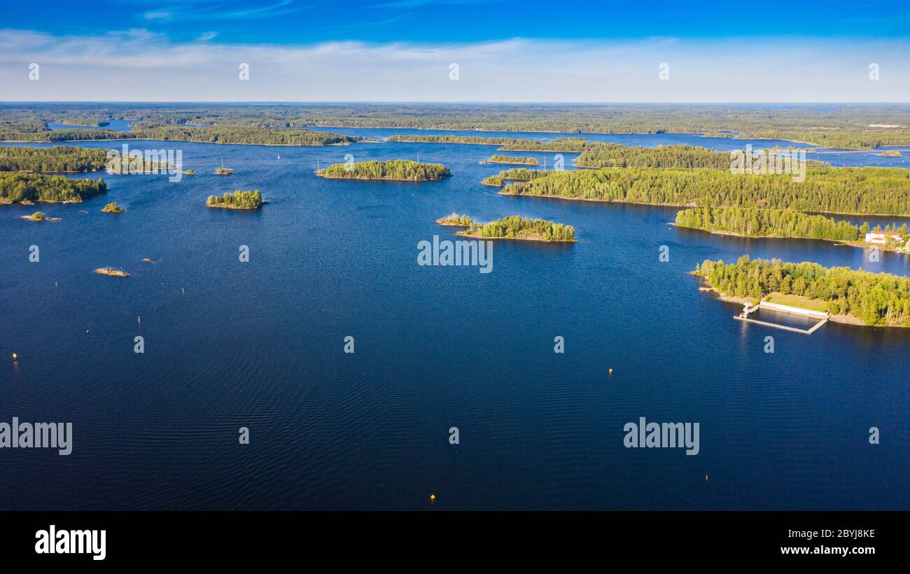Aerial view of blue lakes and green forests on a sunny summer day in Finland. drone photography Stock Photo