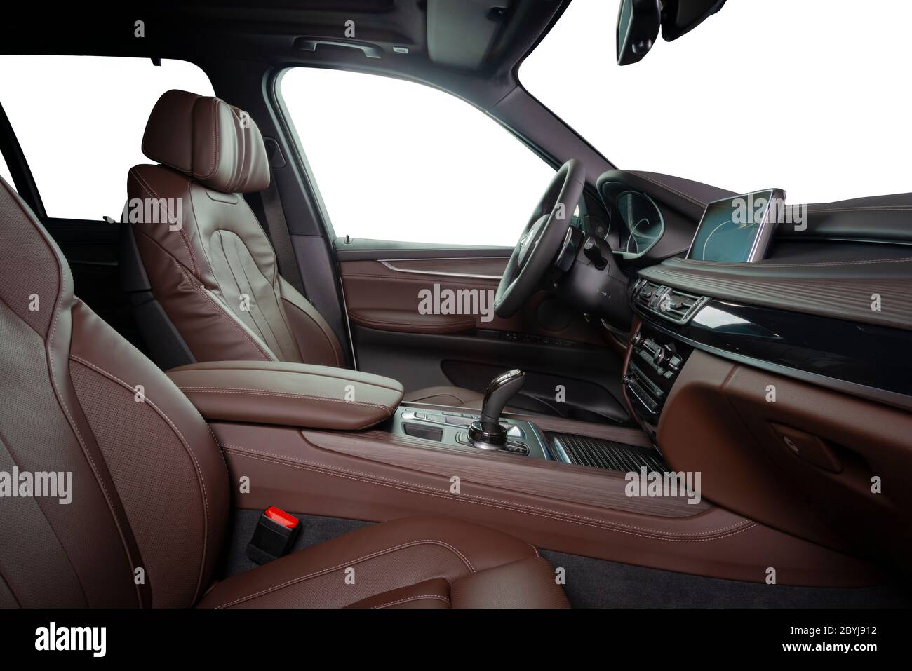 Orange red sand leather luxury car inside Interior - steering wheel, shift lever and dashboard. Stock Photo