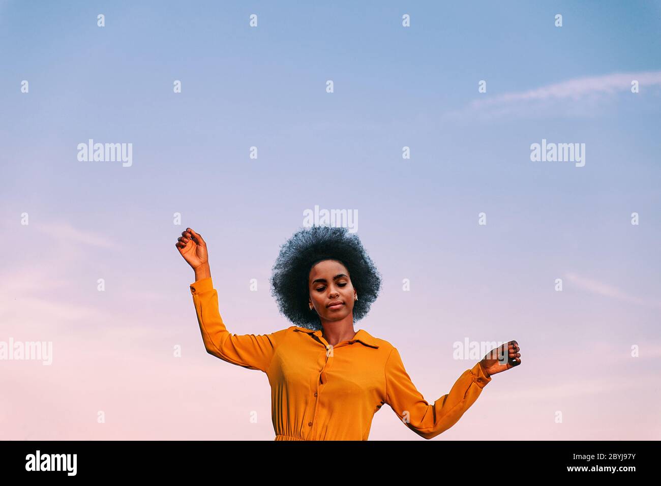 black woman dancing with the wind Stock Photo