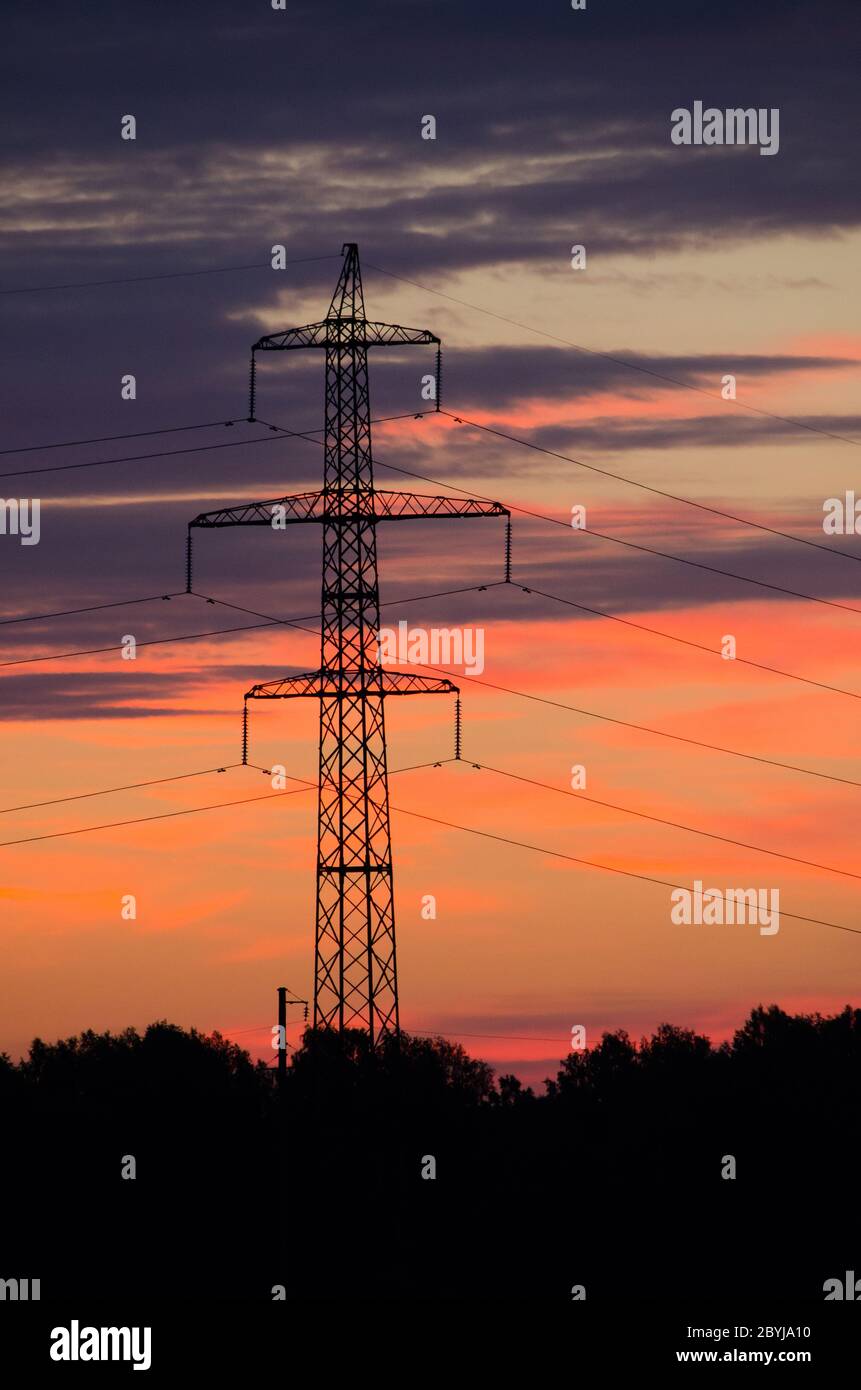 Support for power lines at sunset and beautiful sky with clouds Stock ...