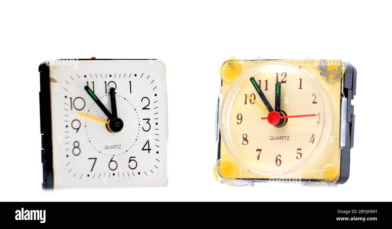 pictureof a vintage damaged alarm clock on white Stock Photo Alamy