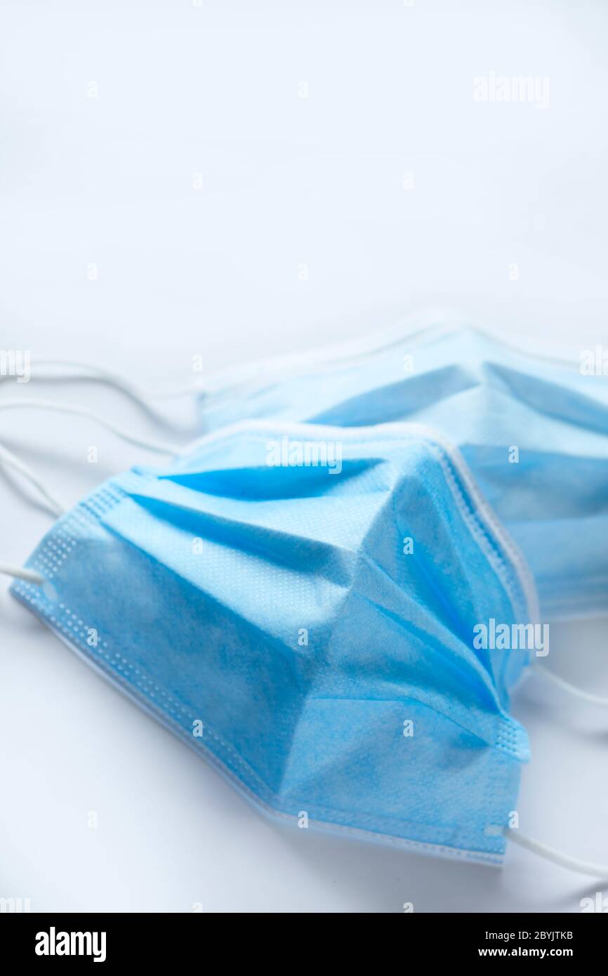 Surgical face masks with elasticated ear loops Stock Photo