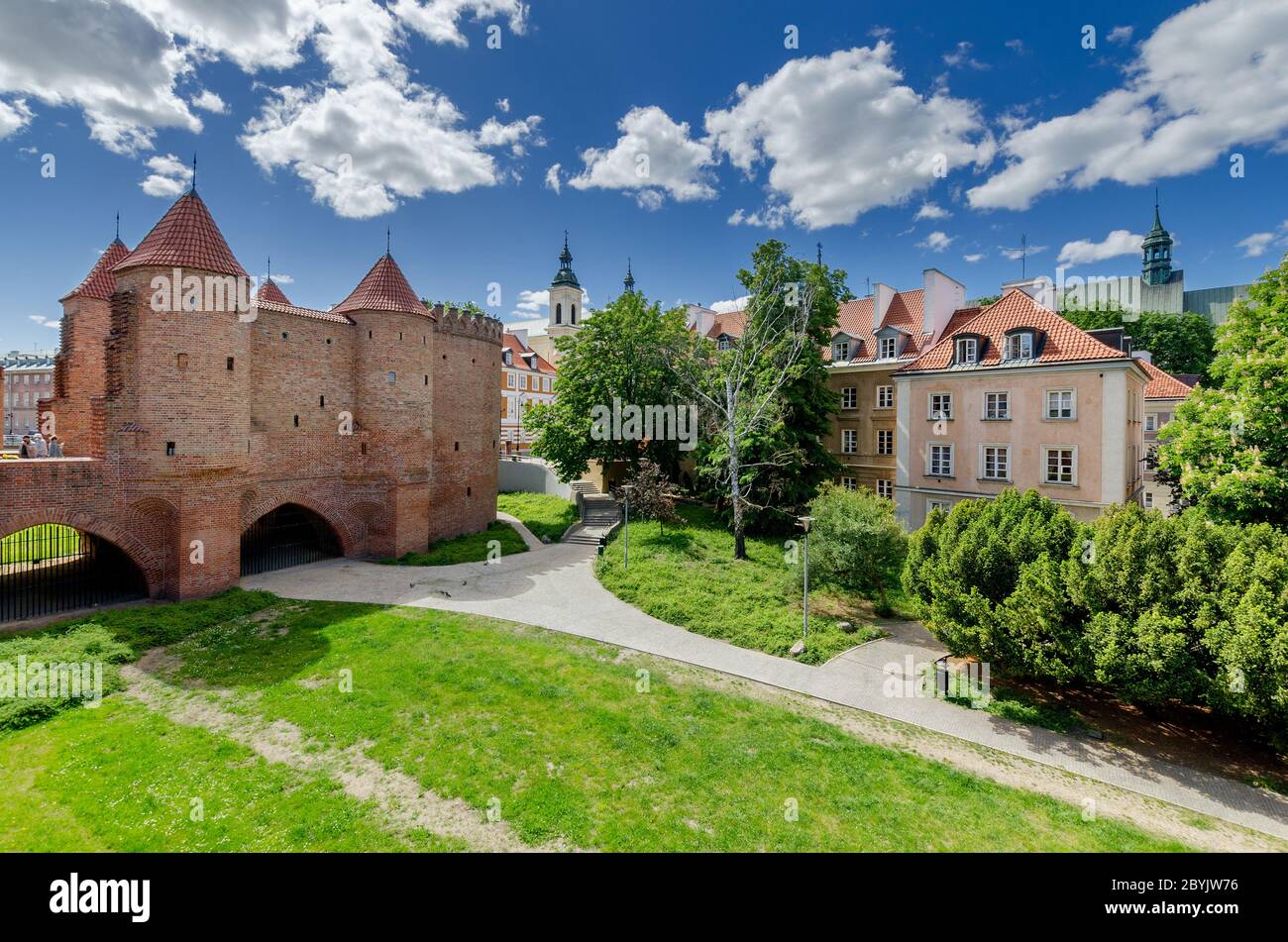 Warsaw, Mazovian province, Poland. View through the moat to the New Town. Barbican fortification on the lef. Stock Photo