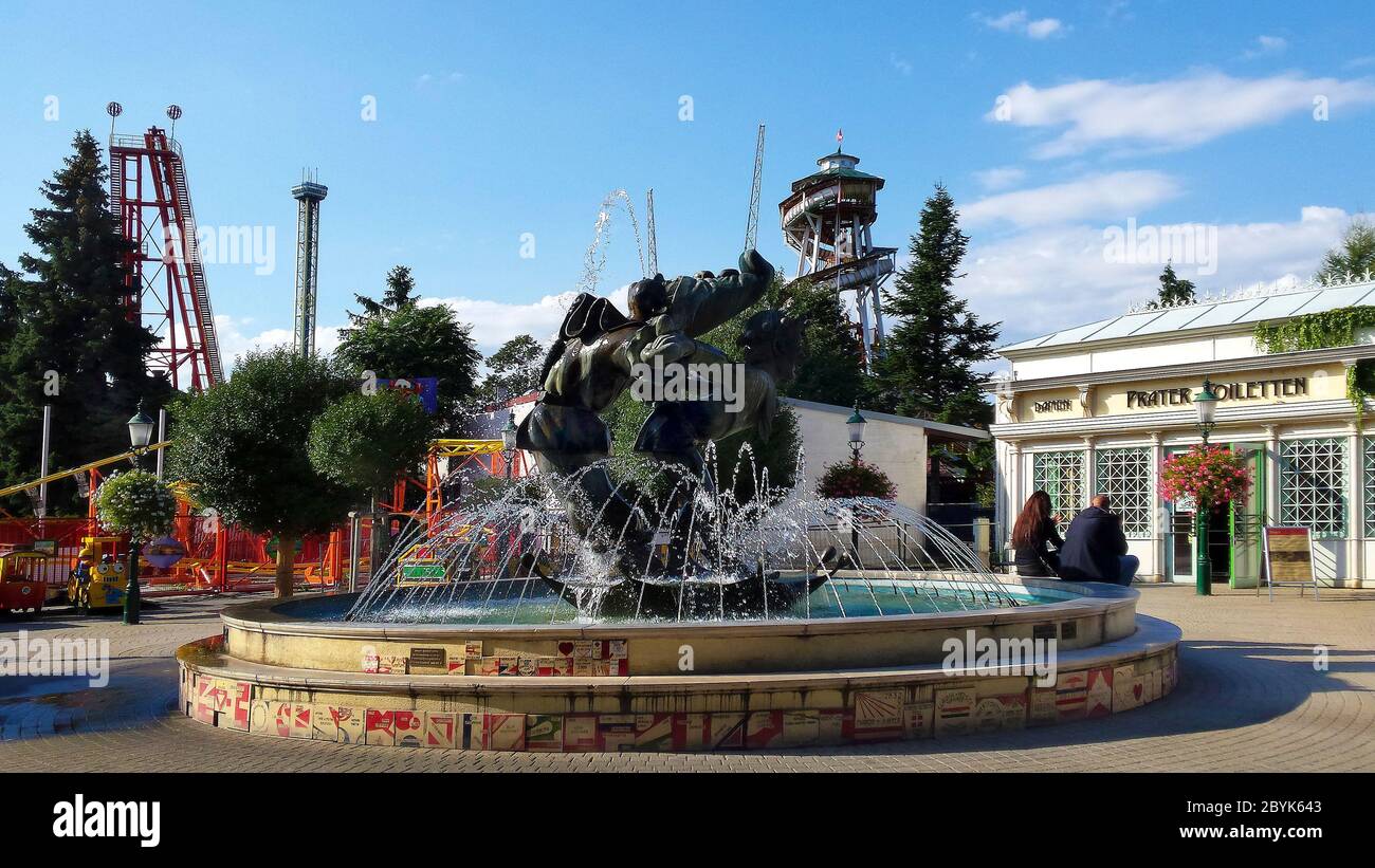 Vienna, Austria - September 04, 2015: Unidentified people, fountain, sculpture, public toilet and different attractions for amusement and fun Stock Photo