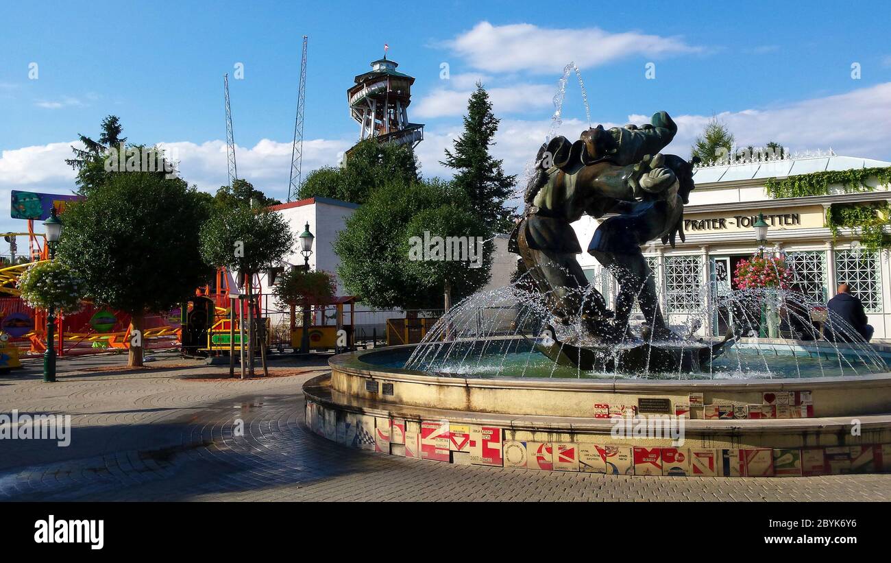 Vienna, Austria - September 04, 2015: Fountain and public toilet in amusement park in Vienna named Prater, one of the oldest amusement parks worldwide Stock Photo