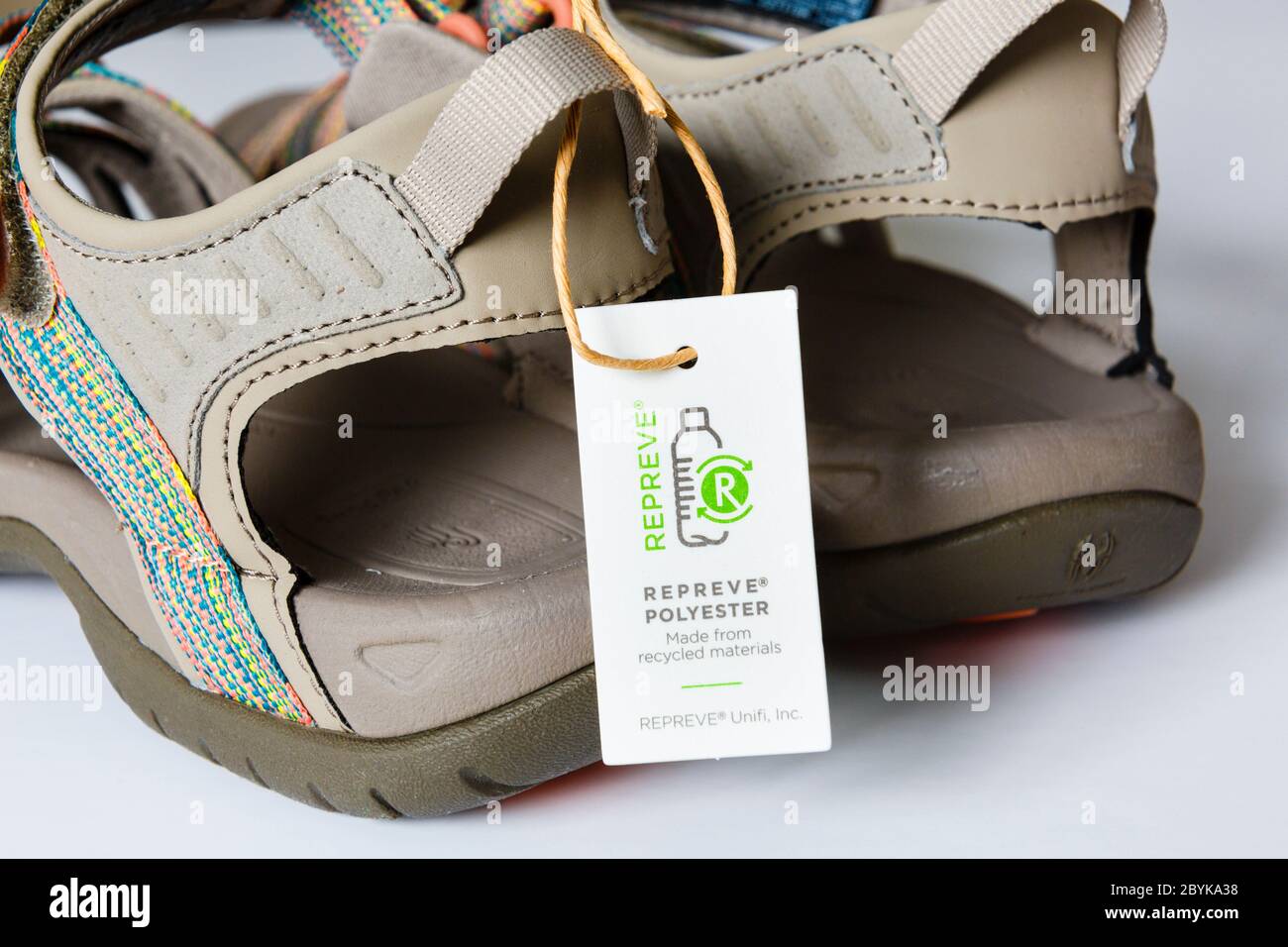 Close up of a label on a pair of sandals made from Repreve Polyester recycled plastic materials. England, UK, Britain Stock Photo