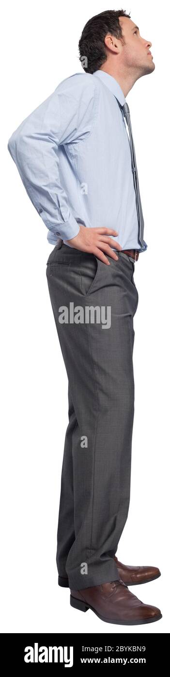 Serious businessman with hand on hip Stock Photo