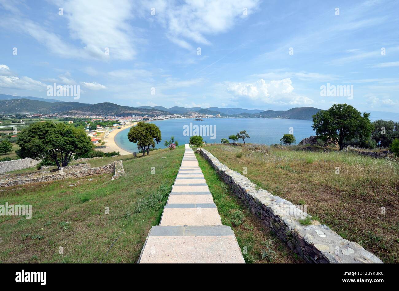 Greece, steps in ground of medieval castle Anaktoroupolis with view to beach in Nea Peramos on Aegean Sea Stock Photo