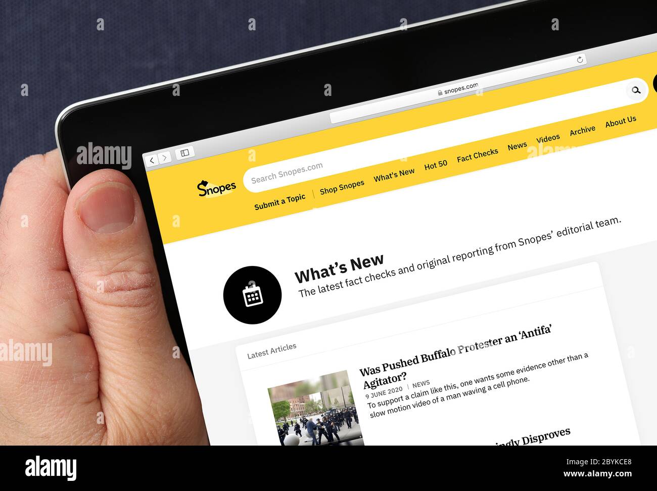 Snopes website, viewed on a iPad. (editorial use only) Stock Photo