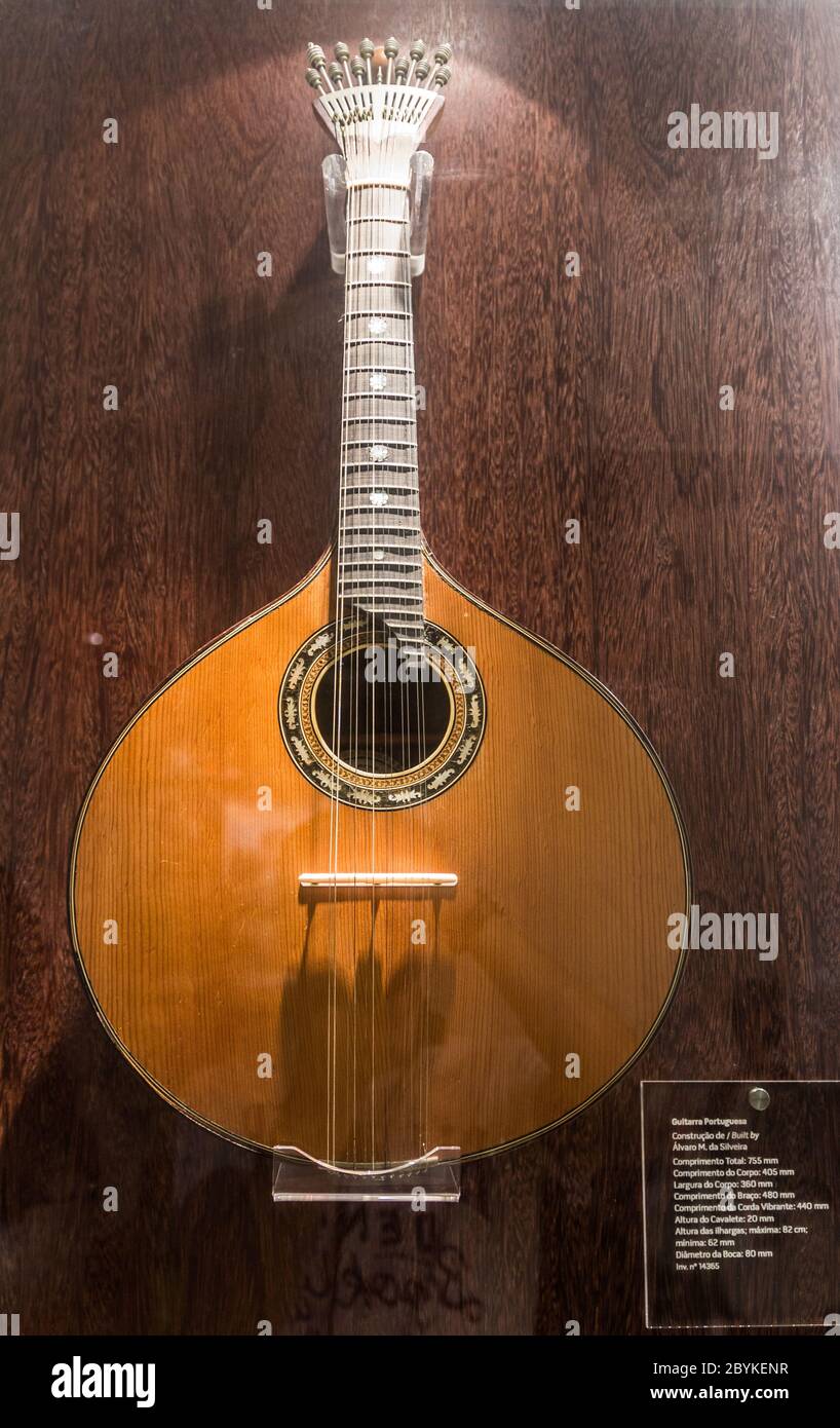 Portuguese guitar, Museo do Fado (Museum of Fado), Lisbon, Portugal. September 2019. Beautiful plucked string instrument with twelve steel strings. Stock Photo