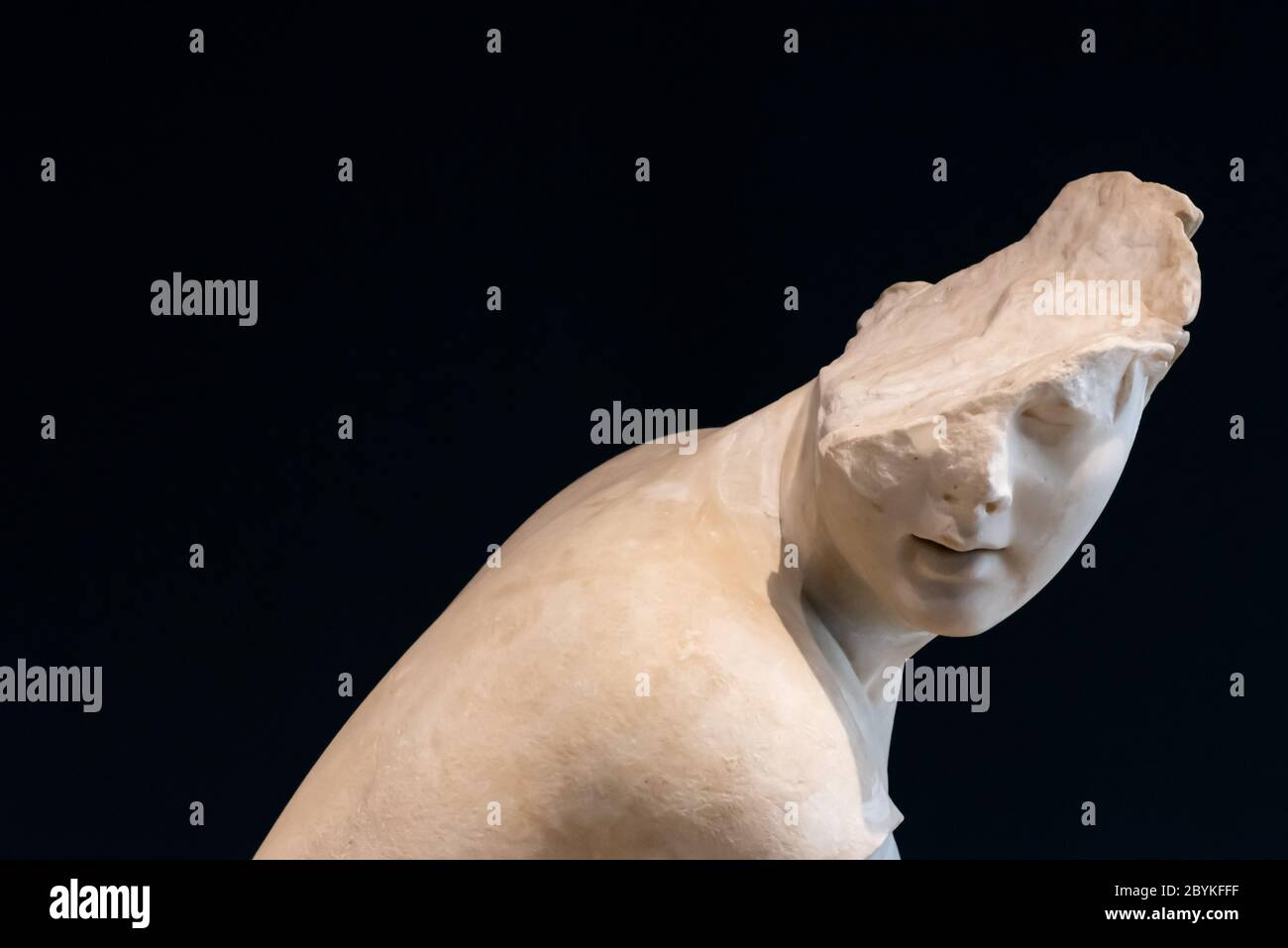 Ancient roman statue of young person with a broken face Stock Photo