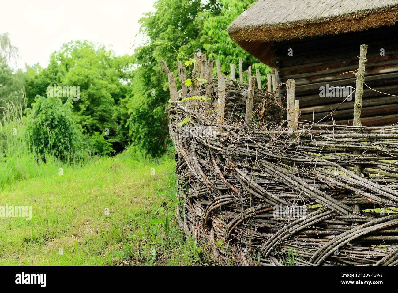 Wooden rural fence in village near the house near the forest. Authentic ...