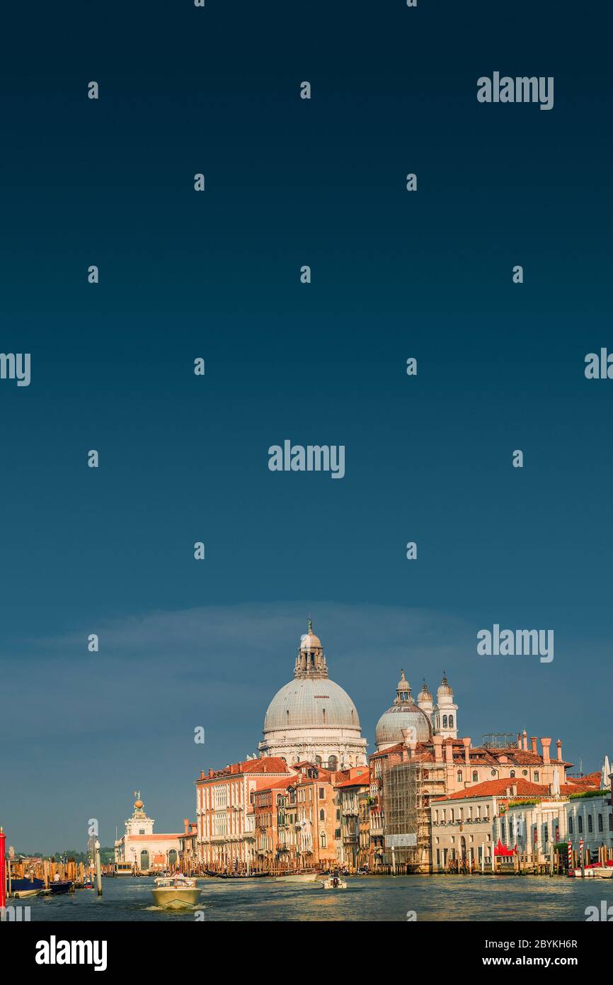 Grand Canal and Basilica di Santa Maria della Salute during sunset in ...