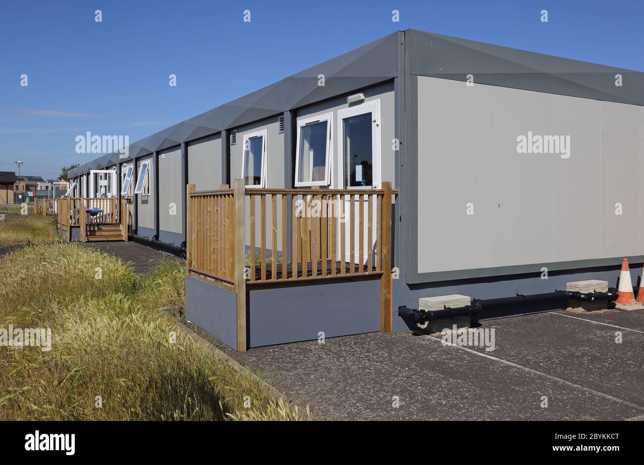 Temporary classrooms erected in the playground  of a London junior school, UK. Built from modular units manufactured off site and craned into position Stock Photo
