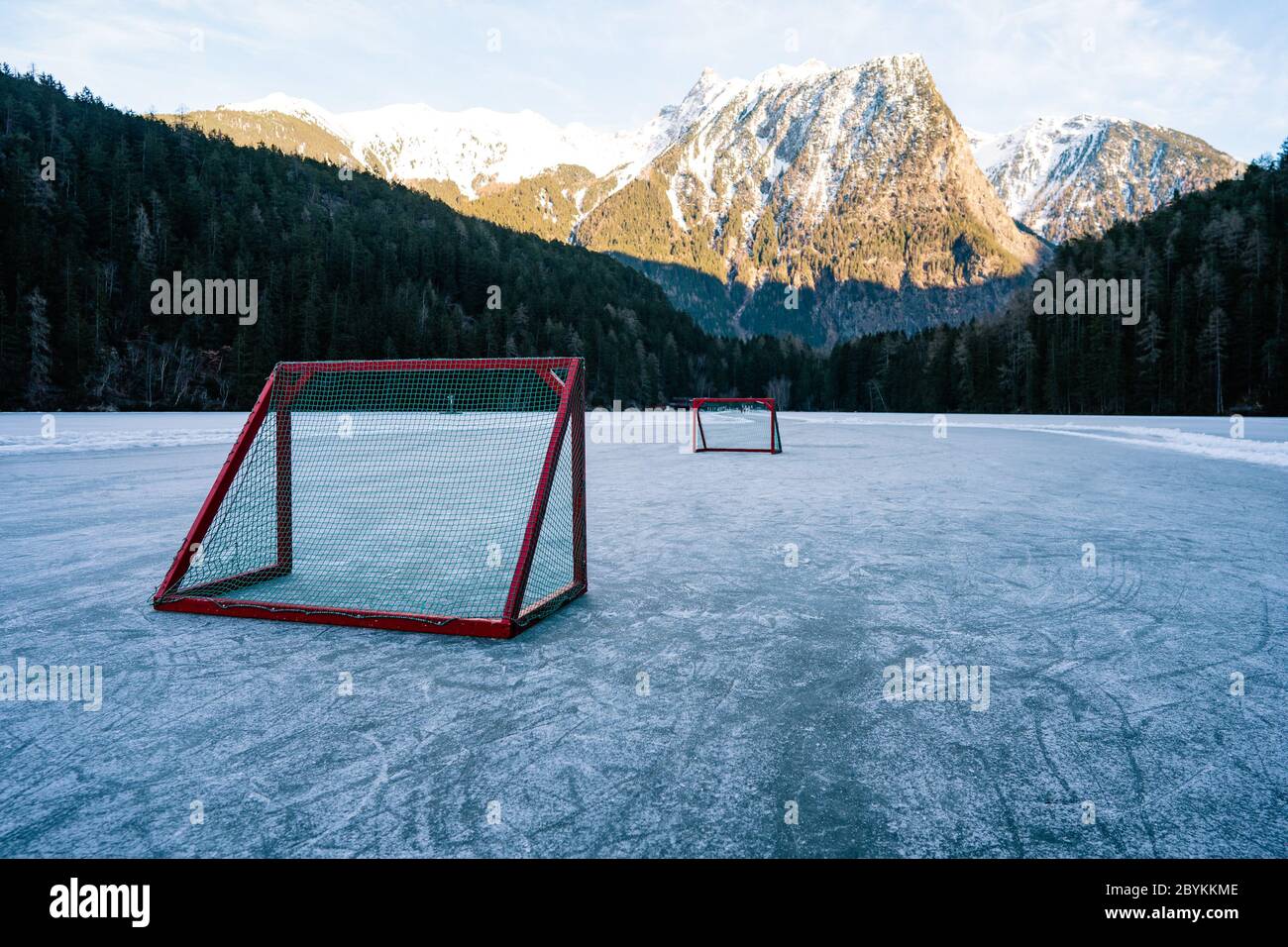 Pond hockey on frozen Lake. Ice hockey goal on an empty open air ice