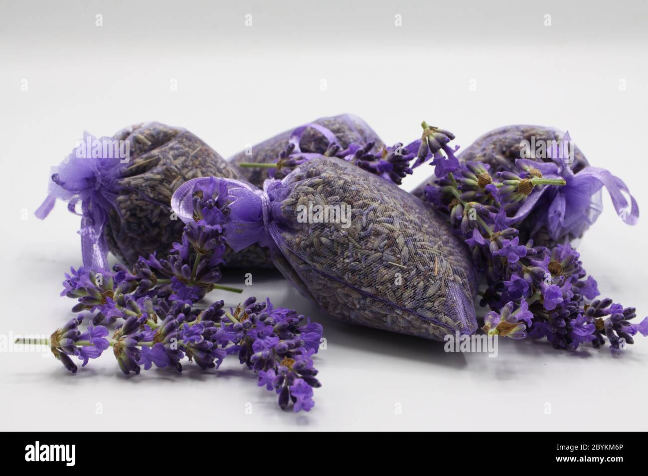 https://c8.alamy.com/comp/2BYKM6P/close-up-of-isolated-bagged-dried-lavender-blossom-sacs-used-as-moth-repellent-in-wardrobe-for-clothes-protection-white-background-2BYKM6P.jpg