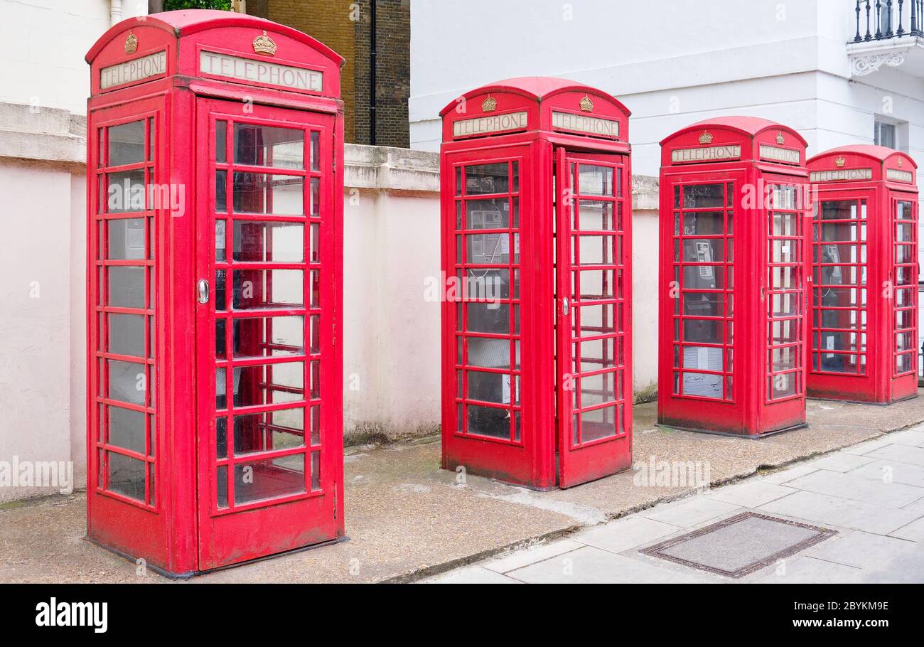 Four Telephone Boxes on Belgrave Road Pimlico South West london. Stock Photo