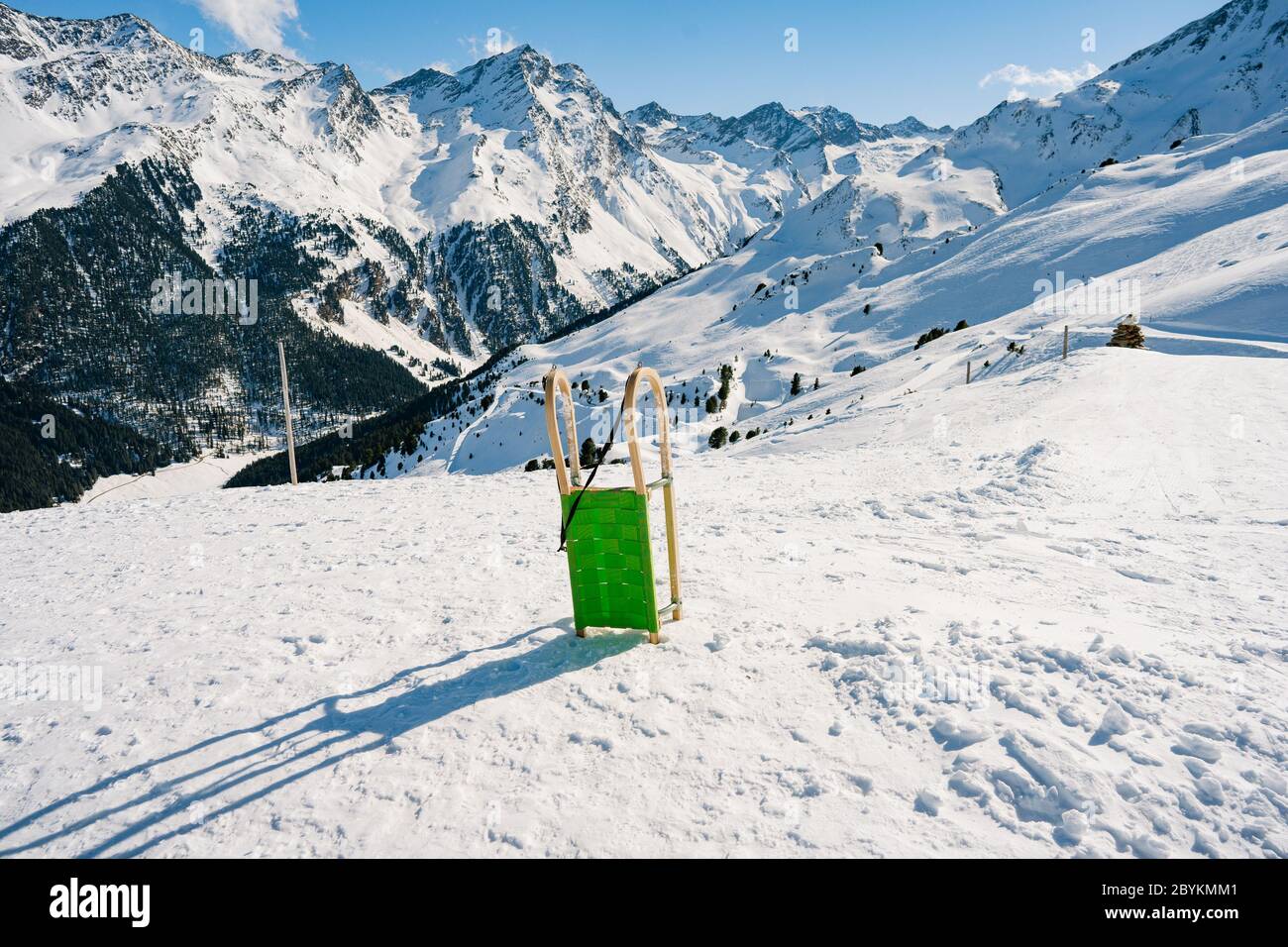 WINTER HOLIDAY. Natural sled runs in Praxmar and in the Sellrain Valley, Austria Alps. Perfect for sociable fun in the snow! Stock Photo