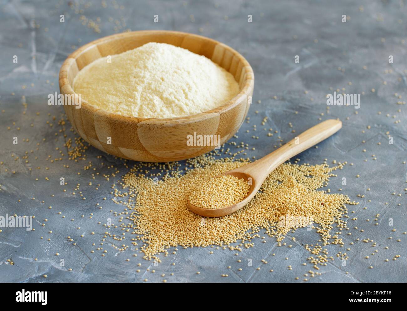 Bowl of raw Amaranth flour with a spoon of Amaranth seeds close up Stock Photo