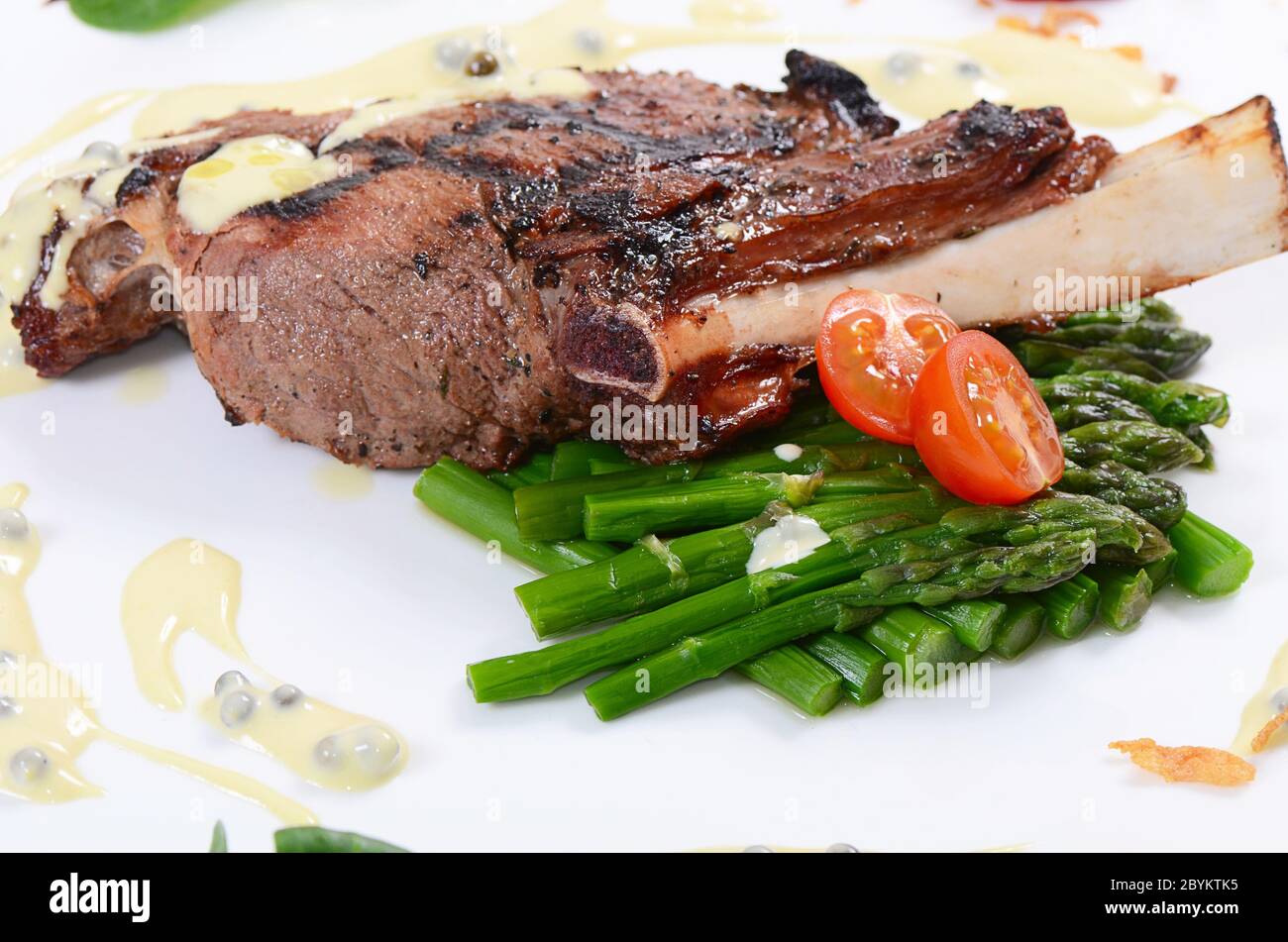 rack of lamb on grill with an asparagus Stock Photo