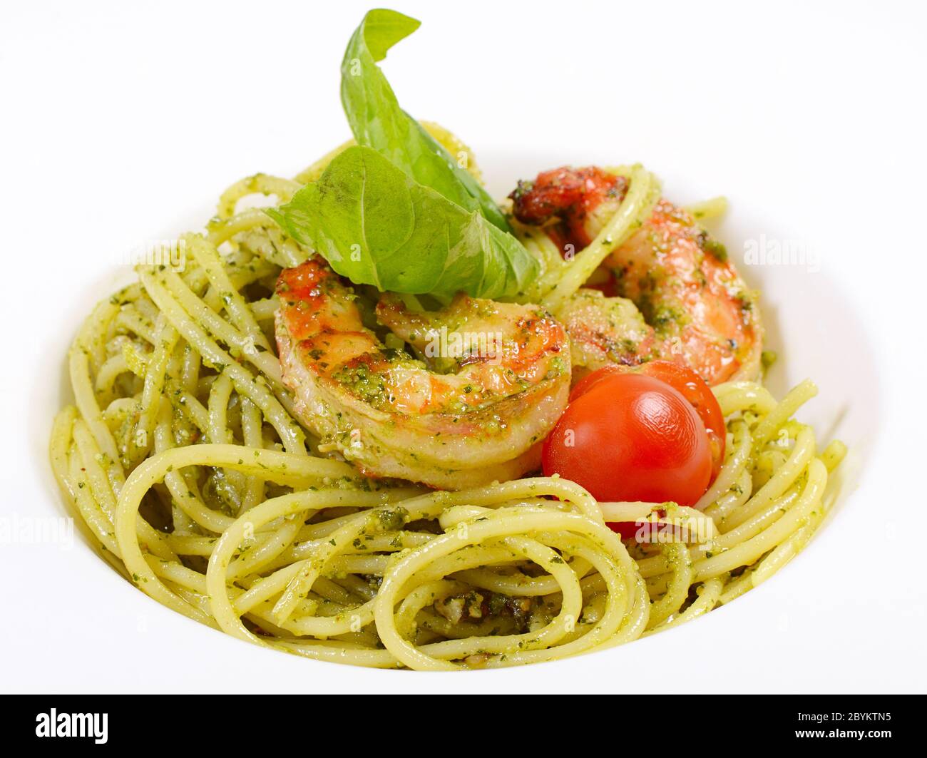 Spaghetti with sauce pesto and shrimps Stock Photo