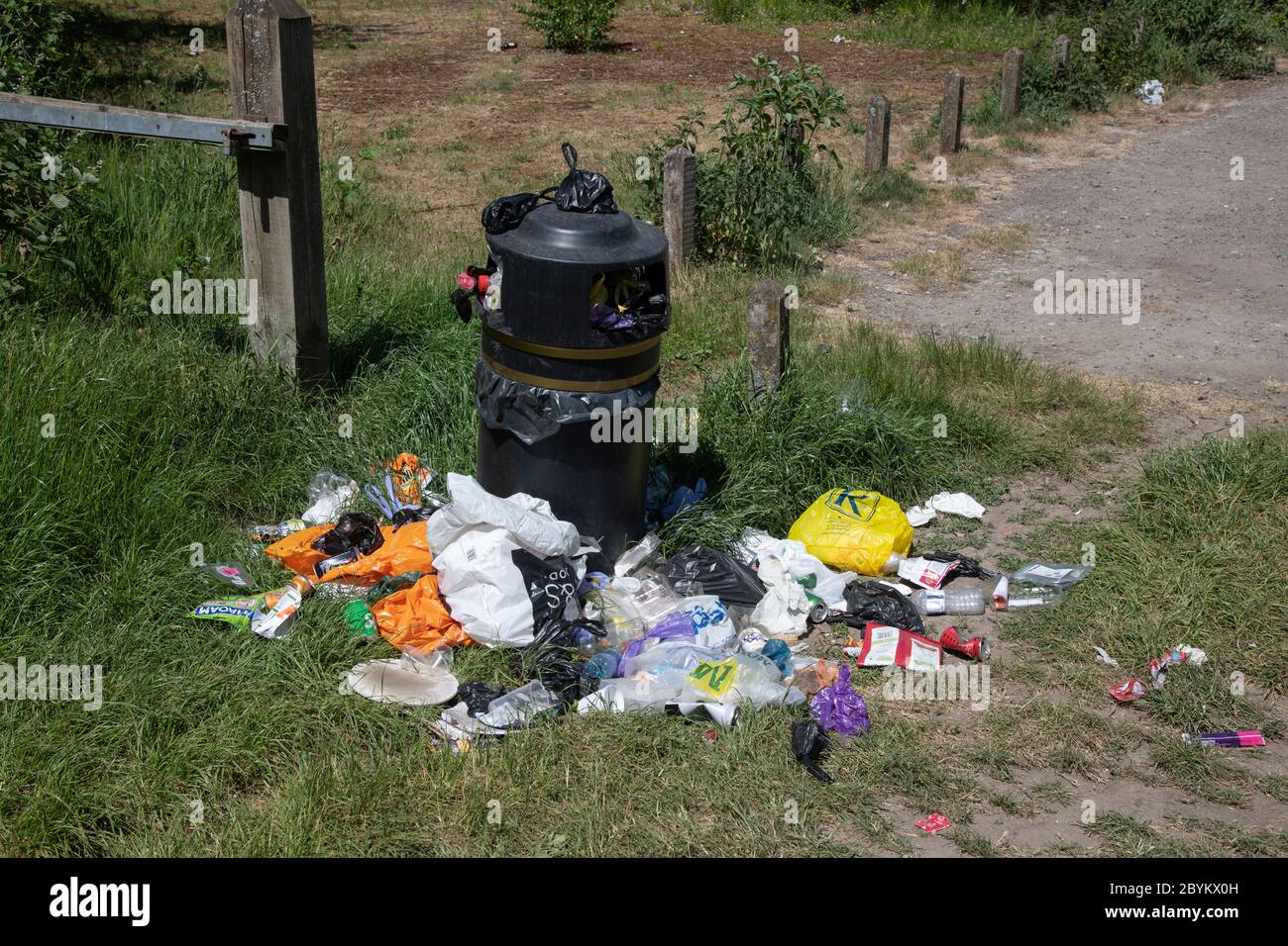 Overflowing rubbish bin, Surrey, UK Stock Photo Alamy