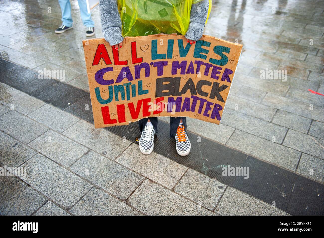 Protestors are demonstrating in the pouring rain in the centre of Enschede to protest against the killing of George Floyd and racism in the USA. Stock Photo