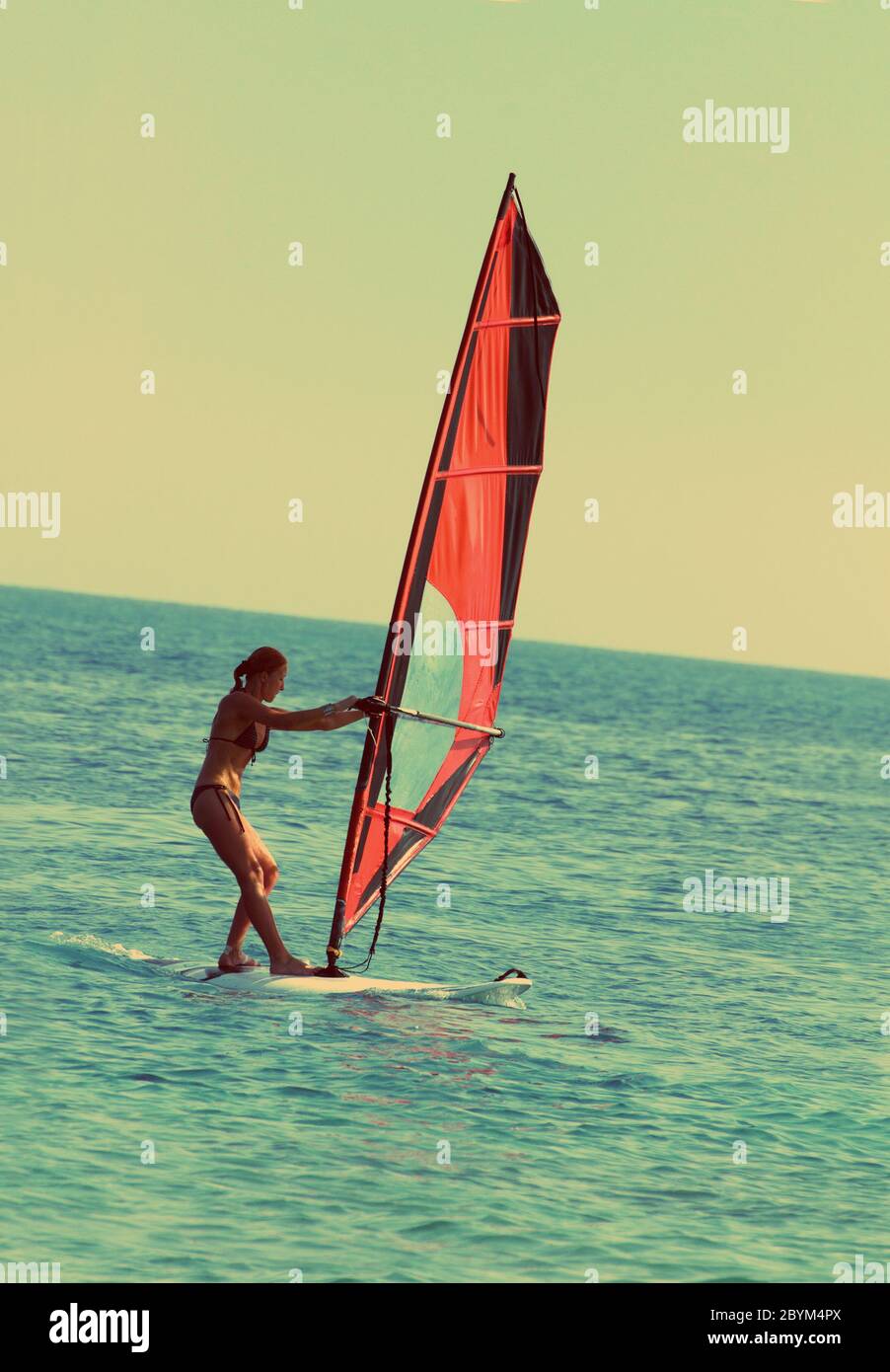 Wind Rocks Sails Retro Windsurfing woman hi-res stock photography and images - Alamy