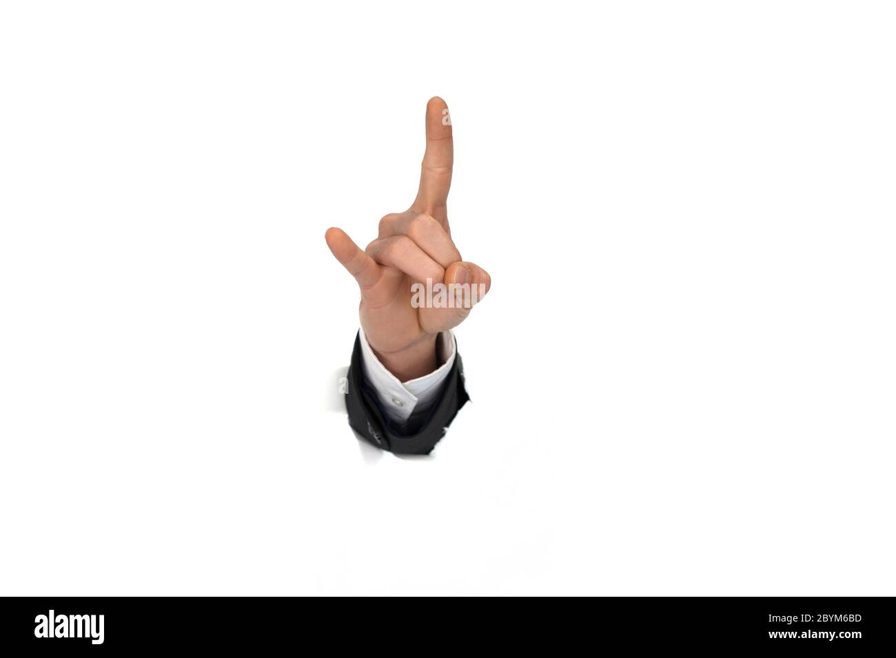 businessman hand breaking through paper wall Stock Photo