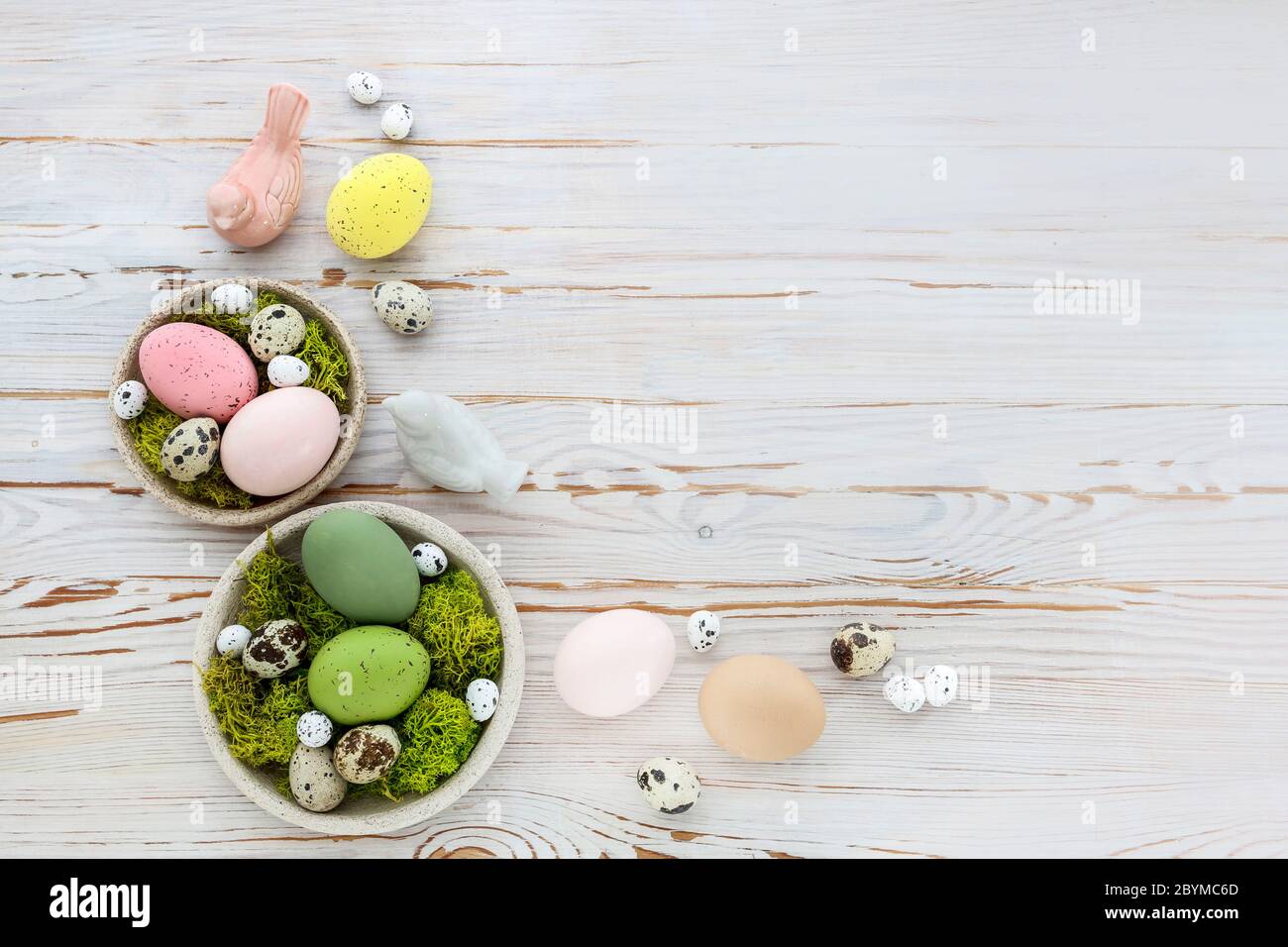 Easter Decorations With Eggs Moss And Ceramic Figurines On White Wooden Table Festive Time Stock Photo Alamy