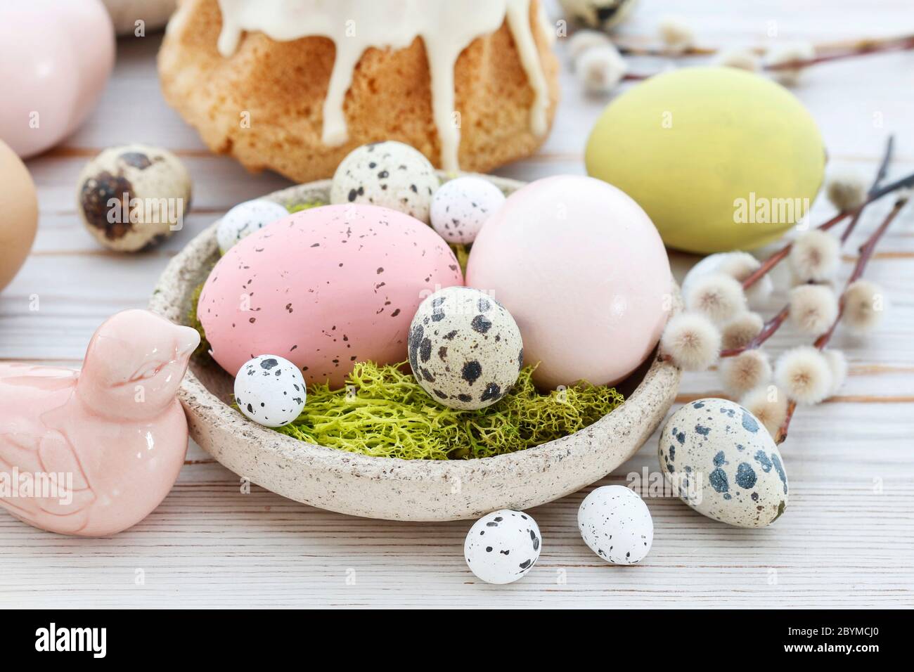 Easter table with cakes, eggs and catkins. Festive decor Stock Photo