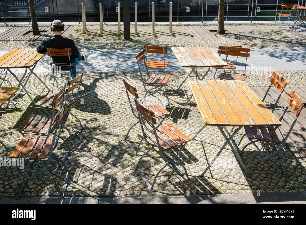 19.04.2020, Berlin, Berlin, Germany - The vacant seats in a closed restaurant opposite the Berlin Cathedral will not be occupied during springlike tem Stock Photo