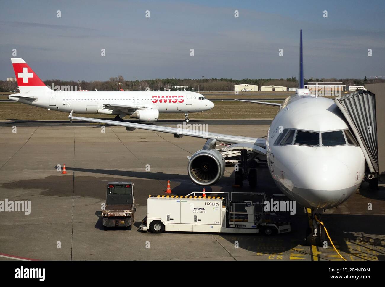 20.03.2019, Berlin, , Germany - Airbus A320 of Swiss International Airlines and A321 of Lufthansa on the apron of Berlin-Tegel Airport. 00S190320D127C Stock Photo
