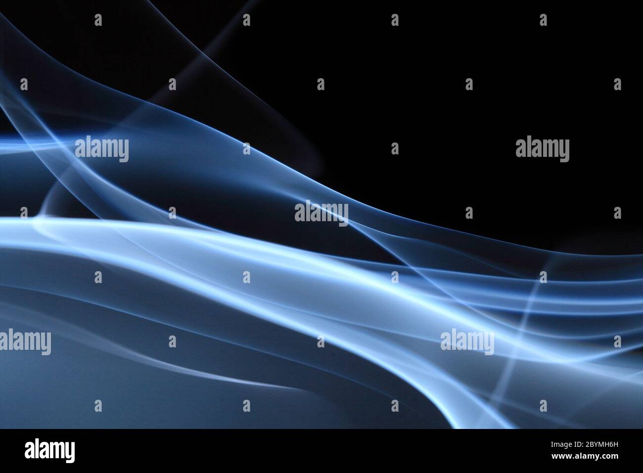 Blue abstract smoke on black background - macro photo Stock Photo - Alamy