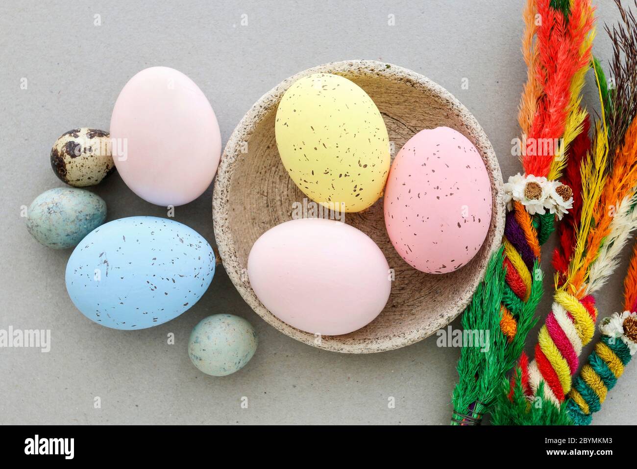 Colorful, painted Easter eggs on a ceramic bowl. Festive decor Stock Photo