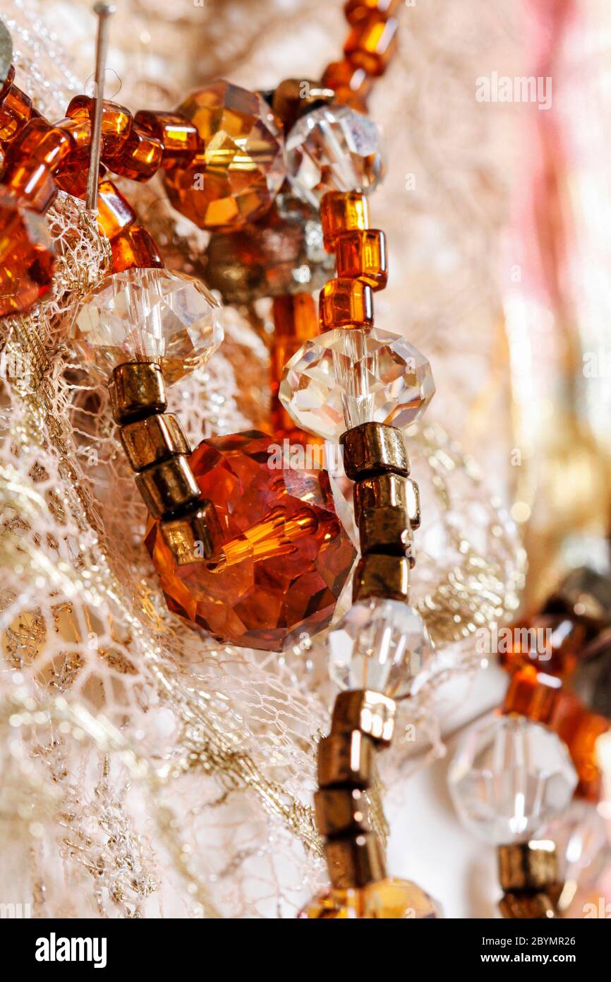 Colorful beads and lace, details of the wedding dress. Party decor ...