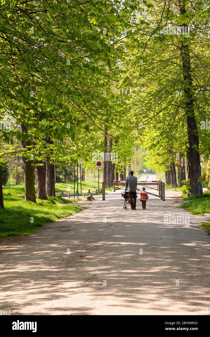 Family walking in Vincennes park, Paris. France Stock Photo