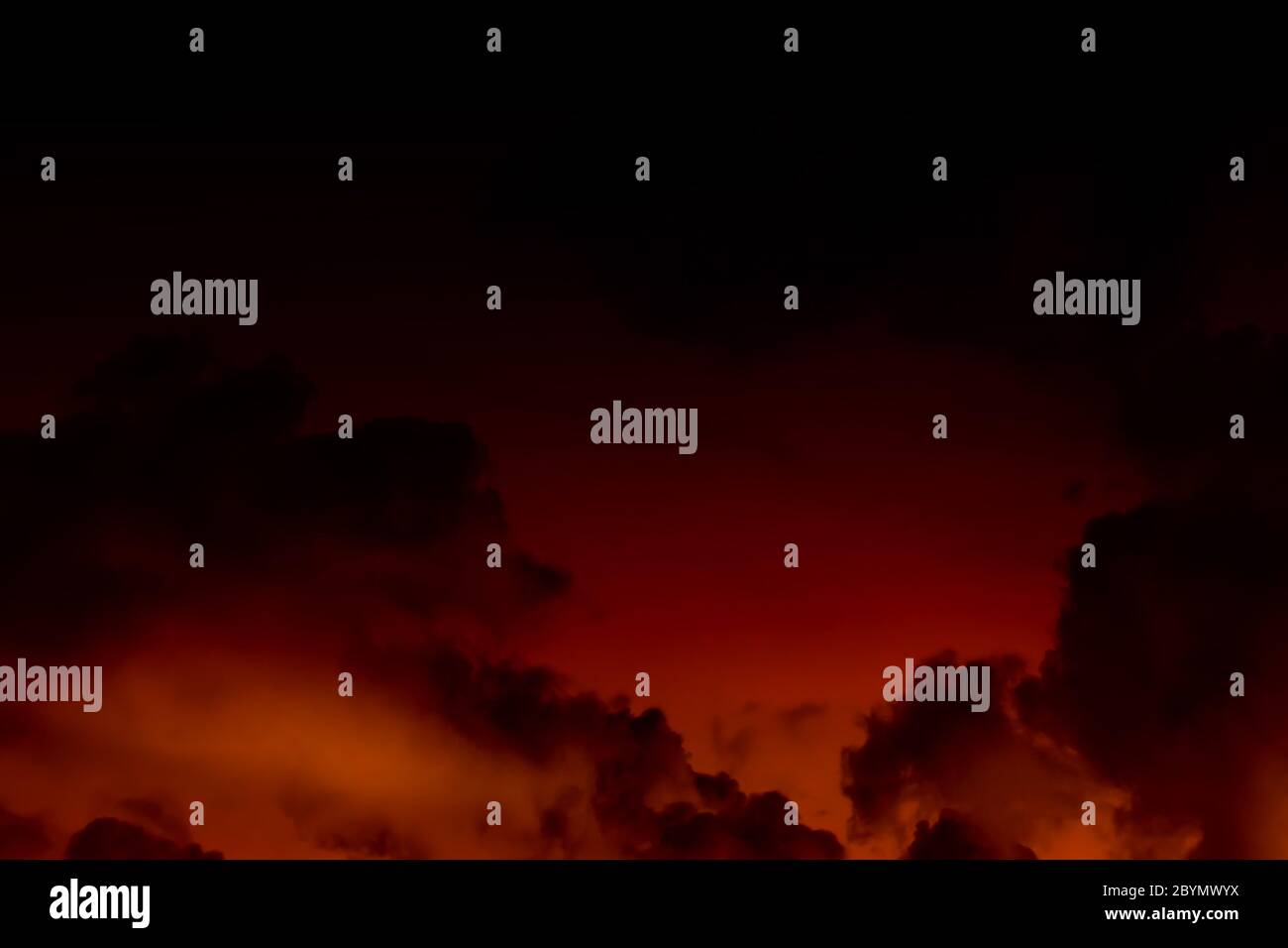 sunset sky with flame cloud background Stock Photo - Alamy