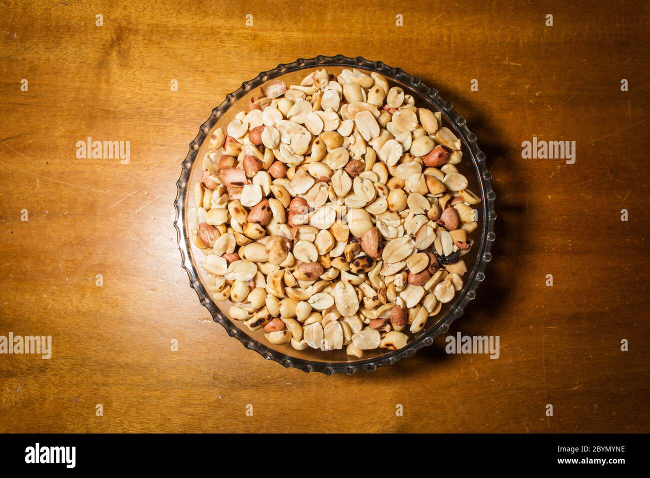peanuts in bowl on vintage background Stock Photo