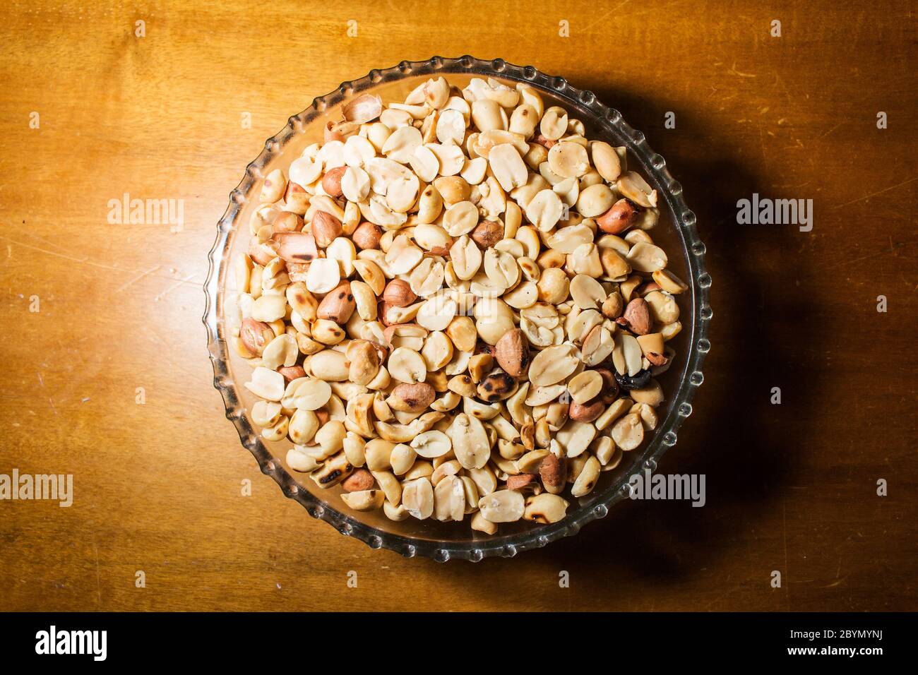 peanuts in bowl on vintage background Stock Photo