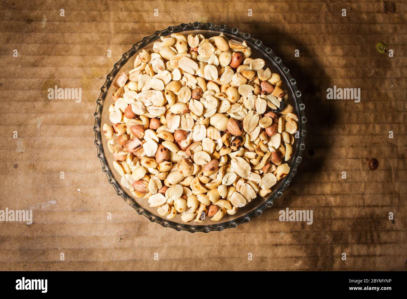 peanuts in bowl on vintage background Stock Photo