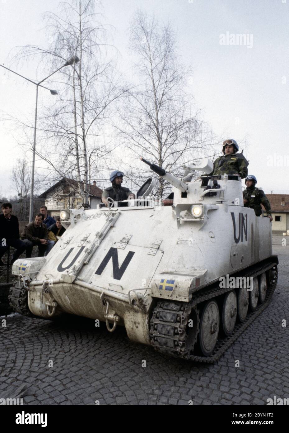 7th March 1994 During the war in Bosnia: a Swedish Häaglunds Pbv (Pansarbandvagn) 302 APC of Nordbat 2 outside the entrance to Tuzla Airport. Stock Photo